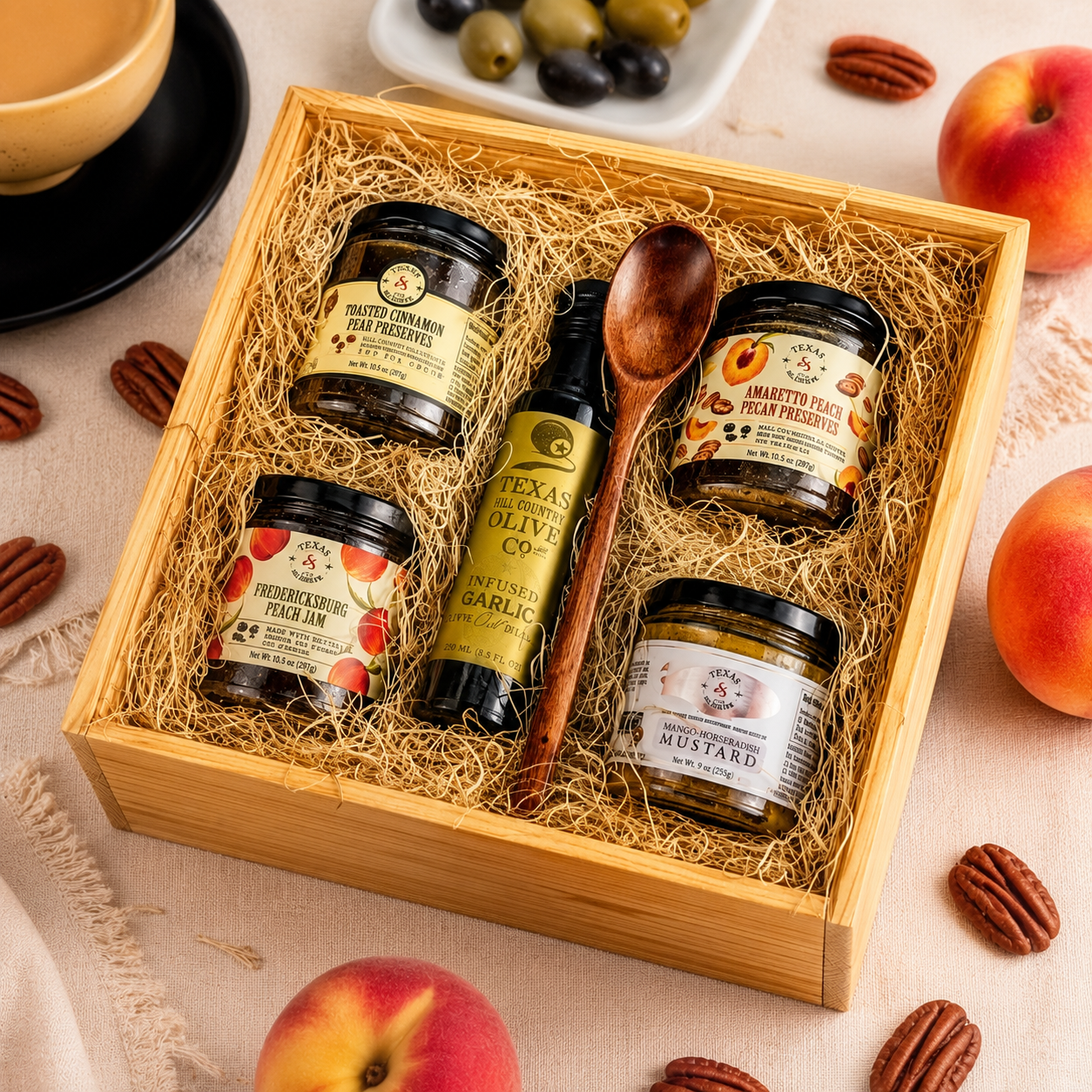 Wooden pantry gift tray with Texas peach preserves, olive oil, mustard, and serving spoon